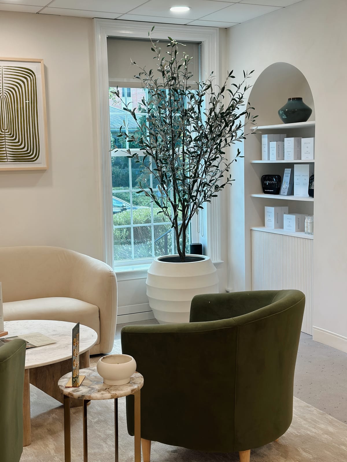 Morristown Ethos lobby detail with olive tree and product shelf