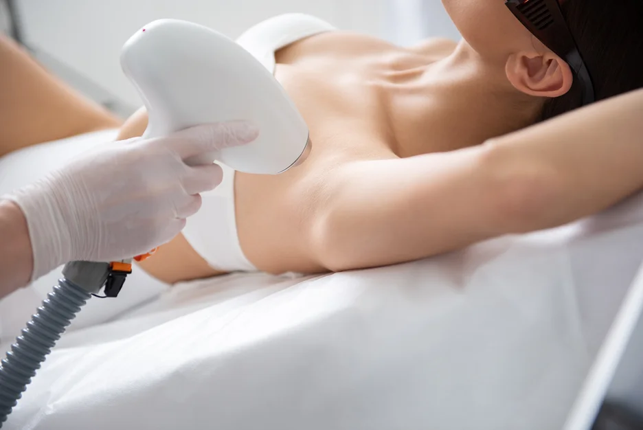 a woman getting laser hair removal treatment