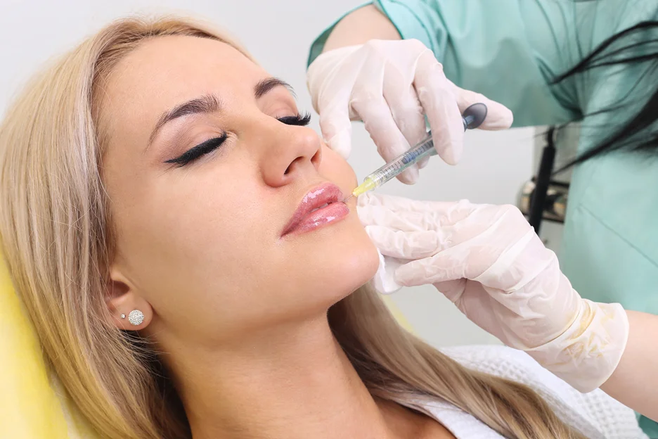 a woman getting lip fillers