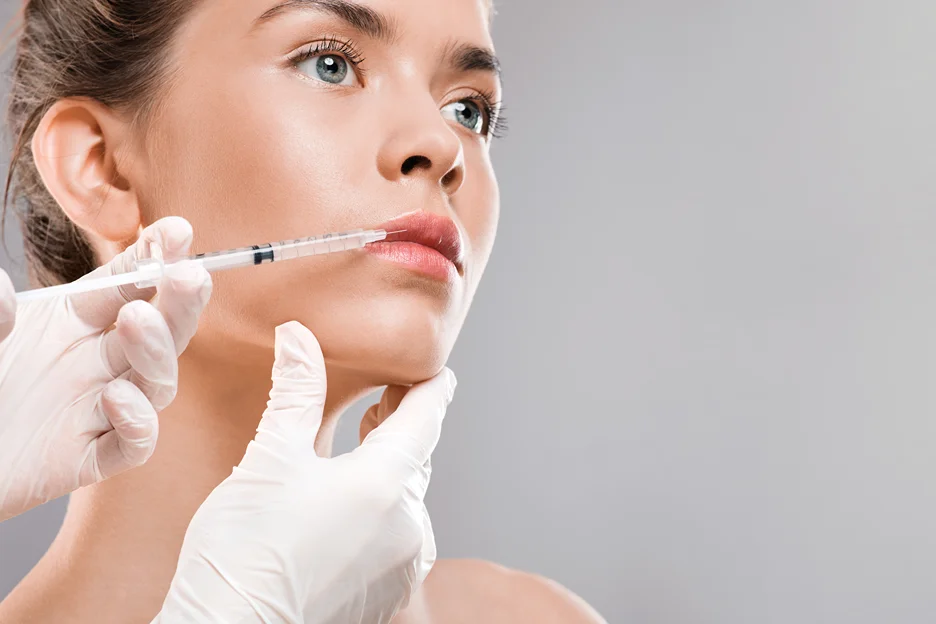 A Woman Getting Hyaluronic Lip Filler Treatment