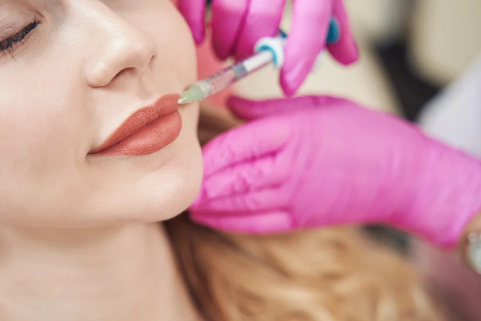 a woman getting lip filler treatment