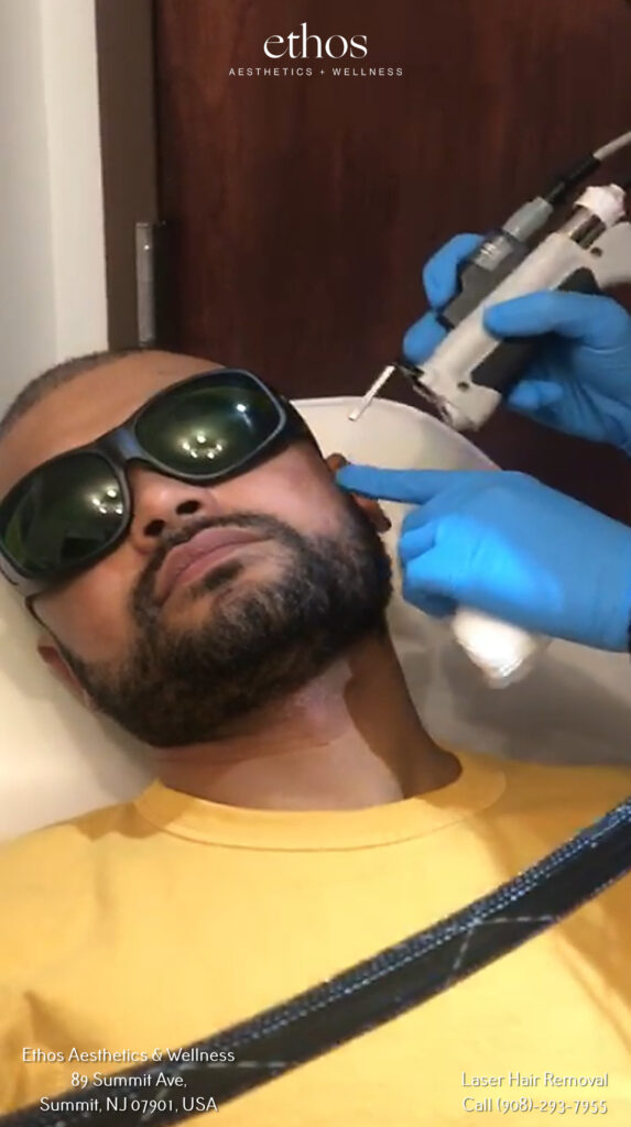 a man getting ear laser hair removal treatment